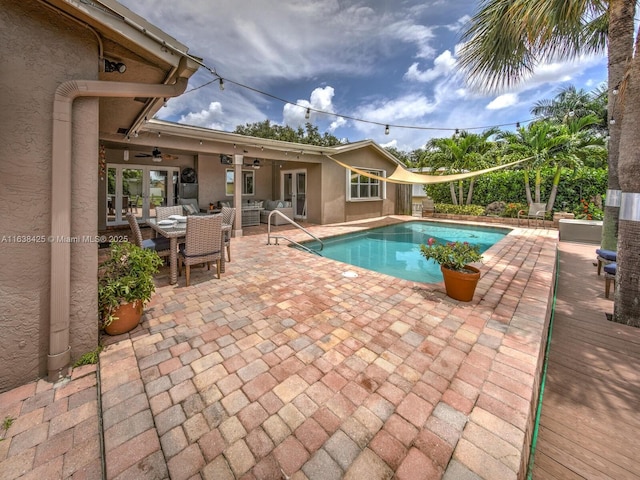 outdoor pool featuring ceiling fan, a patio, and french doors