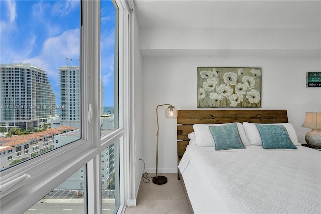 bedroom featuring light tile patterned floors