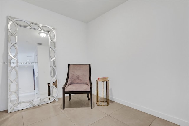 living area featuring light tile patterned floors