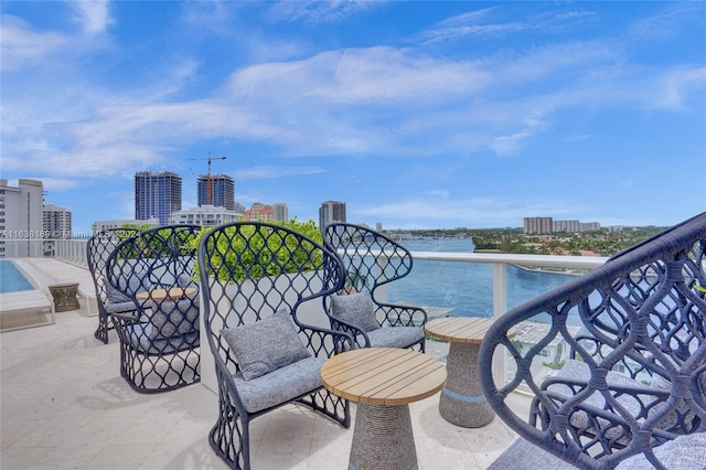 exterior space with a balcony and a water view