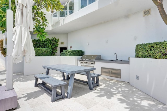 view of patio / terrace featuring sink, area for grilling, and grilling area