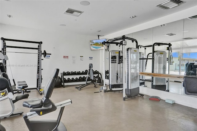 exercise room with concrete floors