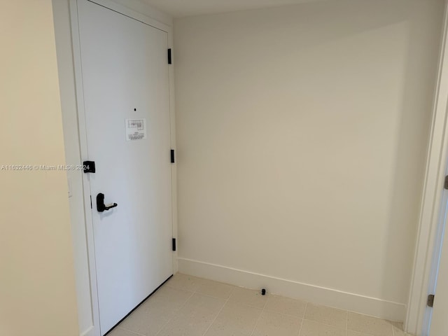 interior space with light tile patterned floors