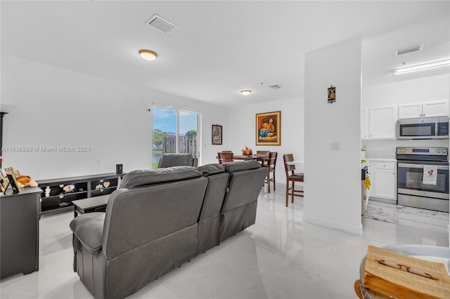 living room with light tile patterned floors