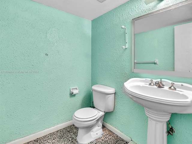 bathroom featuring toilet