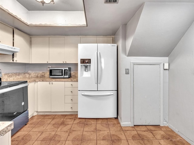 kitchen with extractor fan and appliances with stainless steel finishes