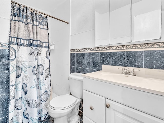 bathroom with toilet, vanity, tile walls, and a shower with shower curtain