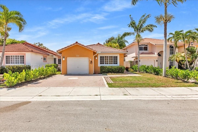 mediterranean / spanish-style home with a garage