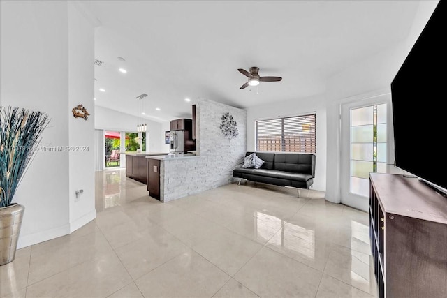 tiled living room with ceiling fan