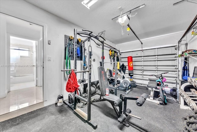 workout room featuring a textured ceiling