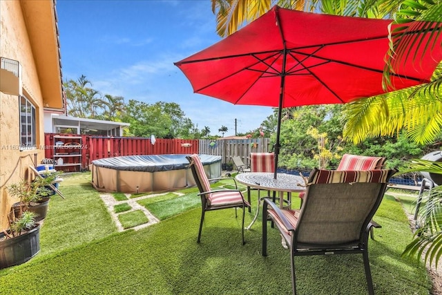 view of yard featuring a covered pool