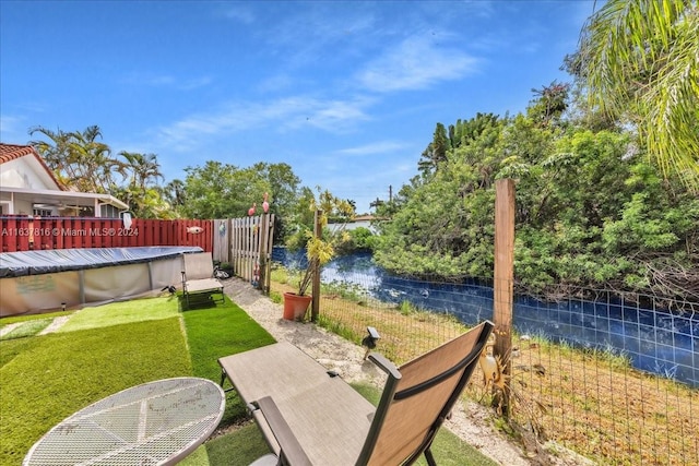 exterior space with a deck with water view