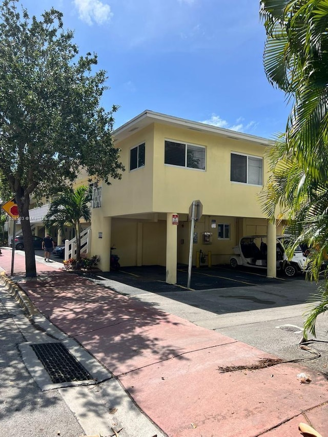 view of front of home with a carport