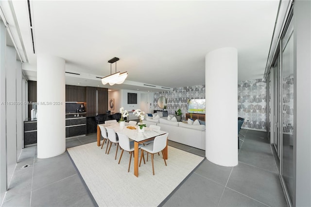 dining space featuring light tile patterned floors