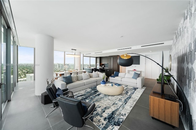 living room featuring plenty of natural light and a wall of windows