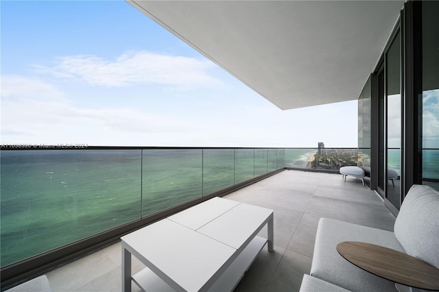 balcony featuring a water view