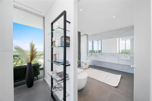 2000 S Ocean Dr Unit 31B, Hallandale Beach, FL 33009 - full bathroom featuring a soaking tub and vanity