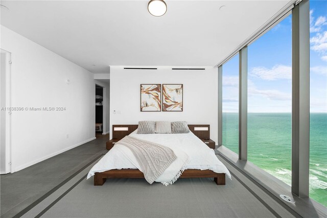 2000 S Ocean Dr Unit 31B, Hallandale Beach, FL 33009 - bedroom with a water view, multiple windows, and a wall of windows