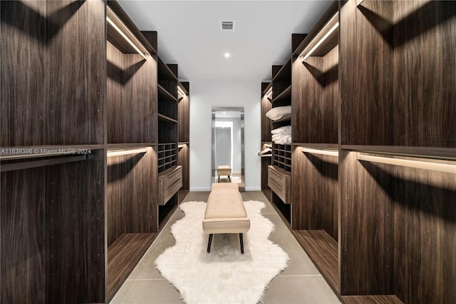 walk in closet featuring light tile patterned floors