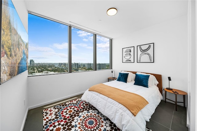 2000 S Ocean Dr Unit 31B, Hallandale Beach, FL 33009 - bedroom featuring baseboards and a city view