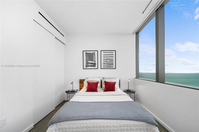 2000 S Ocean Dr Unit 31B, Hallandale Beach, FL 33009 - bedroom featuring a water view, a closet, and baseboards