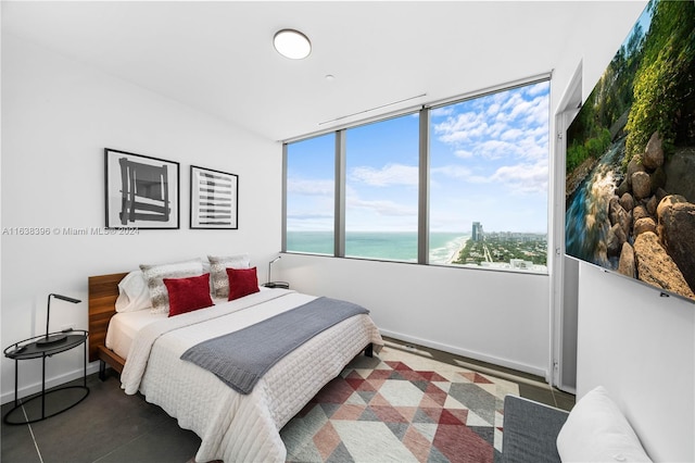 2000 S Ocean Dr Unit 31B, Hallandale Beach, FL 33009 - bedroom featuring baseboards and a water view