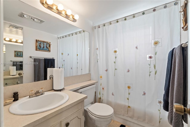 full bathroom featuring vanity, toilet, and shower / bath combo with shower curtain