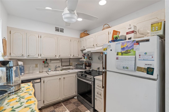 kitchen featuring dishwasher, sink, ceiling fan, stainless steel electric range oven, and white fridge