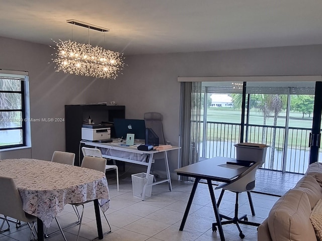 office featuring an inviting chandelier, a wealth of natural light, and light tile patterned floors