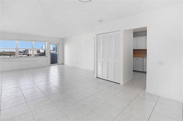 unfurnished living room featuring light tile patterned floors