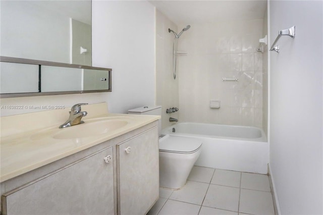 full bathroom with tile patterned floors, vanity, toilet, and tiled shower / bath