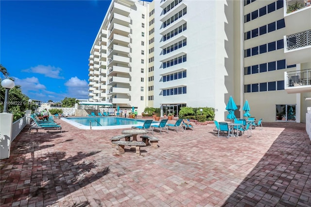 view of swimming pool with a patio area