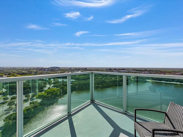 balcony featuring a water view