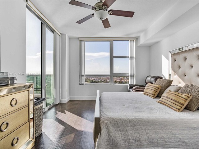 bedroom with ceiling fan, access to outside, and dark hardwood / wood-style floors