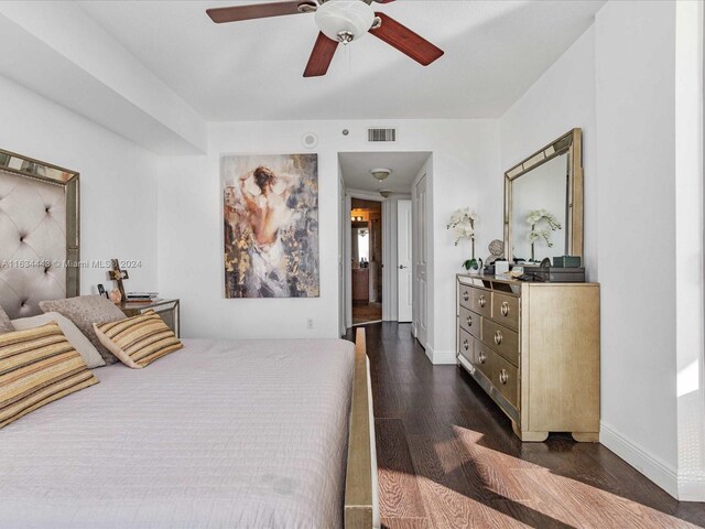 bedroom featuring dark hardwood / wood-style flooring and ceiling fan