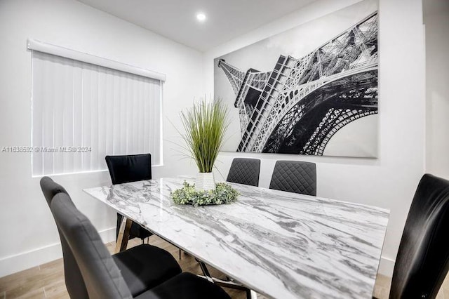 dining area with light hardwood / wood-style flooring