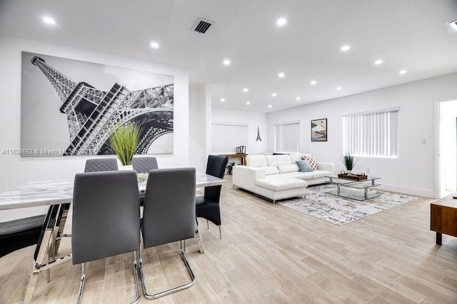 dining space featuring light hardwood / wood-style floors