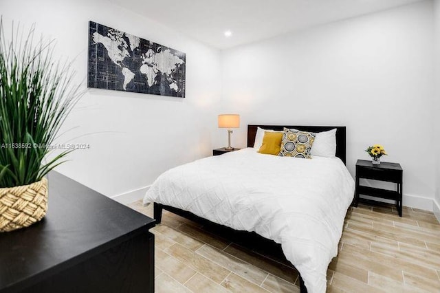 bedroom with light hardwood / wood-style floors