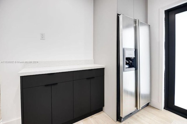 bathroom with hardwood / wood-style flooring