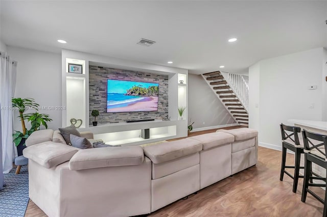 living room with light hardwood / wood-style flooring