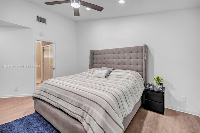 bedroom with hardwood / wood-style floors and ceiling fan