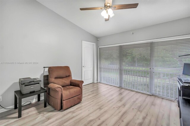 sitting room with lofted ceiling, light hardwood / wood-style flooring, and ceiling fan