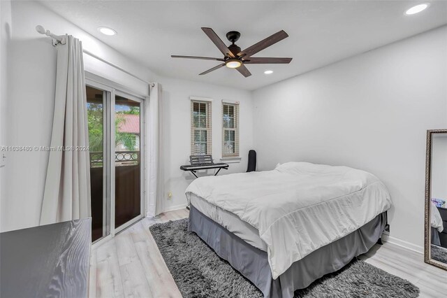 bedroom with ceiling fan and light hardwood / wood-style floors