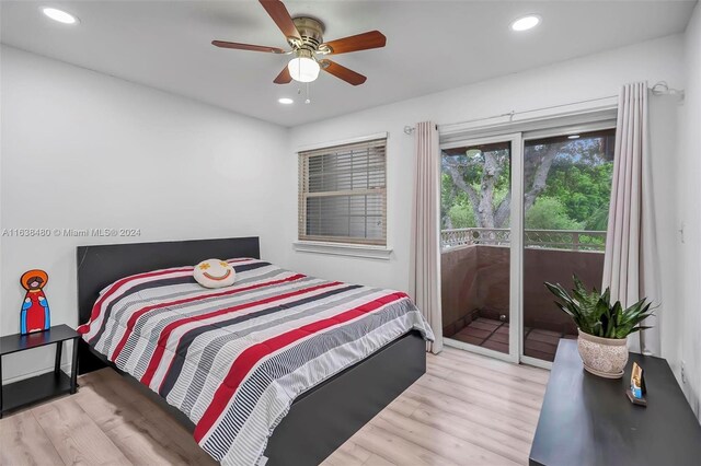 bedroom featuring access to outside, light hardwood / wood-style flooring, and ceiling fan