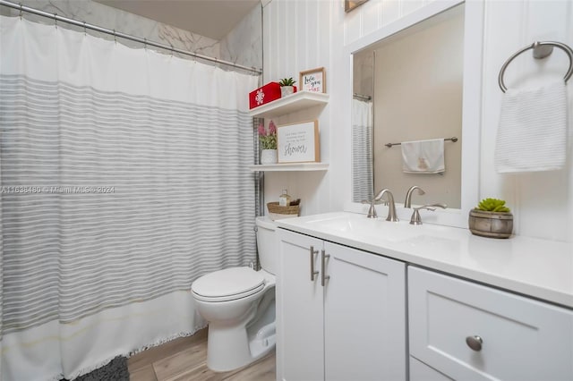 full bathroom with vanity, toilet, hardwood / wood-style floors, and shower / bath combination with curtain