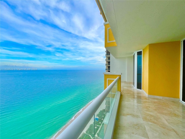 balcony featuring a water view