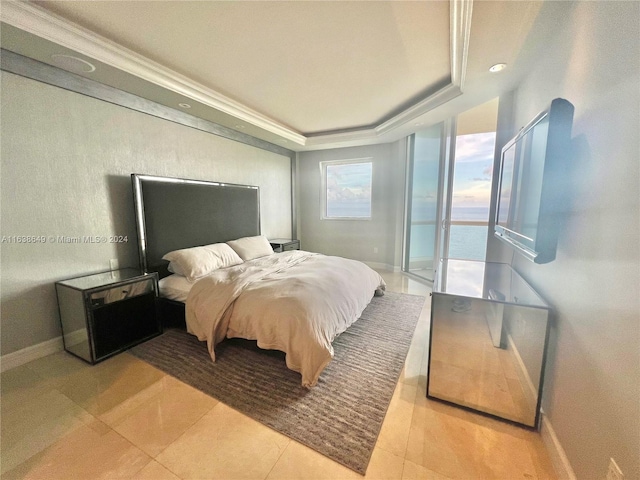 bedroom featuring a tray ceiling, baseboards, and light tile patterned flooring