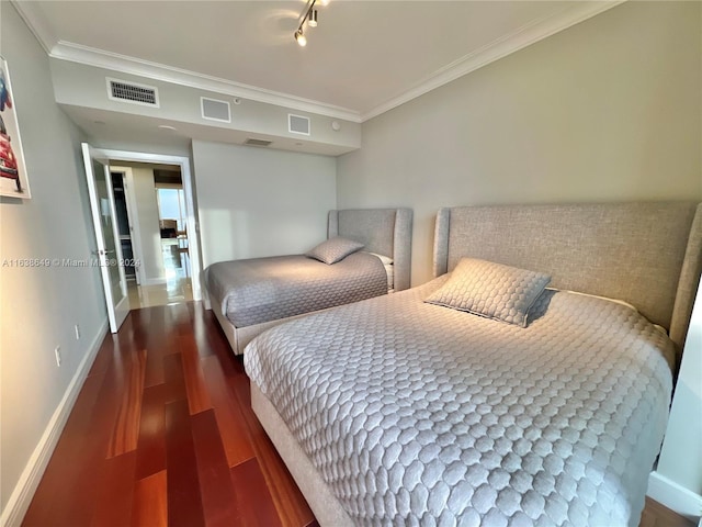 bedroom with dark wood-type flooring and ornamental molding