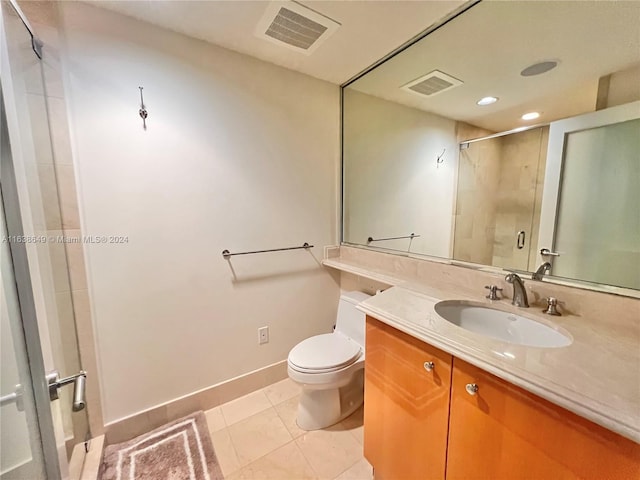 full bathroom featuring tile patterned flooring, visible vents, toilet, and a shower with door