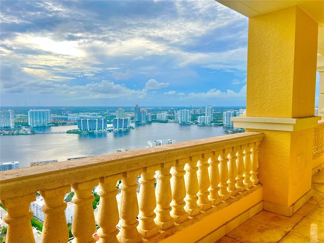 balcony with a view of city and a water view